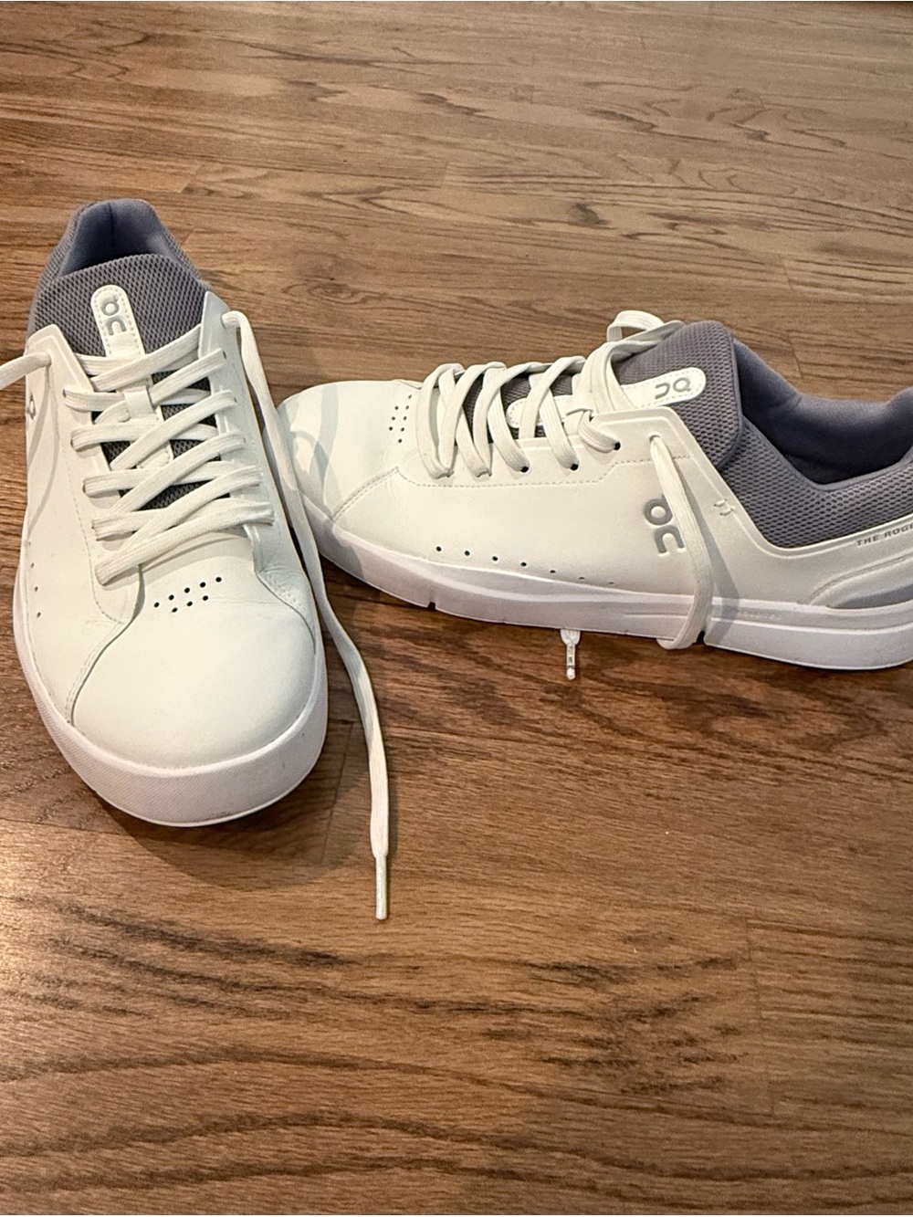 On Running Men's White Sneakers with Light Gray Lining. The Roger